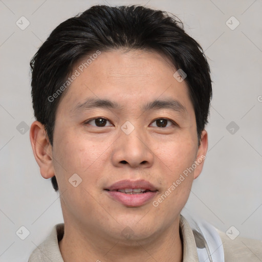 Joyful asian young-adult male with short  brown hair and brown eyes