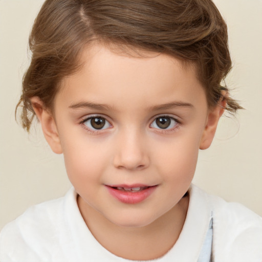 Joyful white child female with short  brown hair and brown eyes