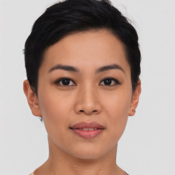 Joyful asian young-adult female with short  black hair and brown eyes