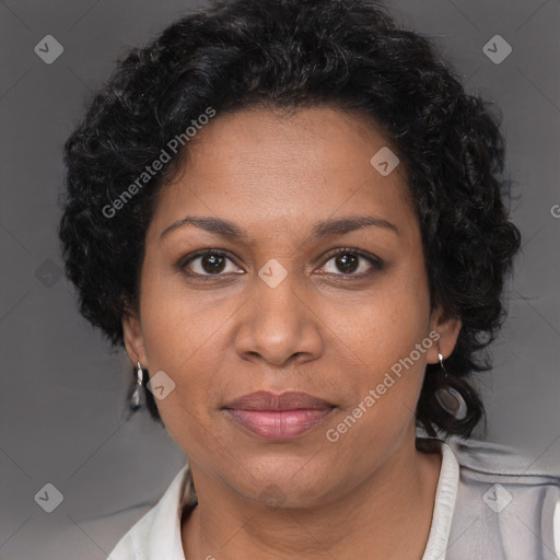 Joyful black adult female with short  brown hair and brown eyes