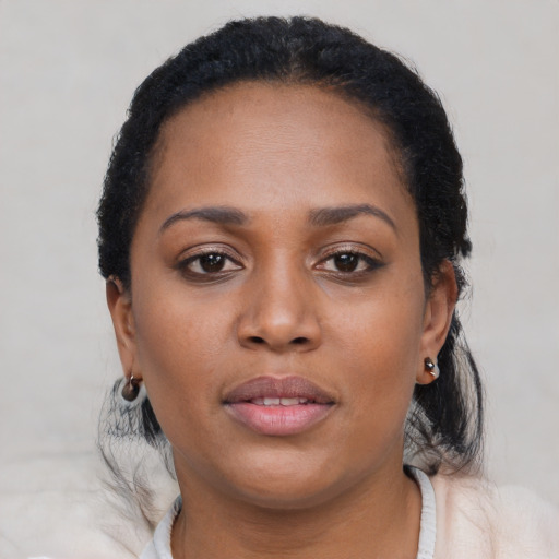 Neutral black young-adult female with short  brown hair and brown eyes