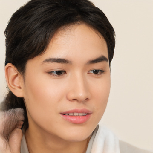 Joyful asian young-adult female with medium  brown hair and brown eyes