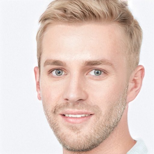 Joyful white young-adult male with short  brown hair and blue eyes