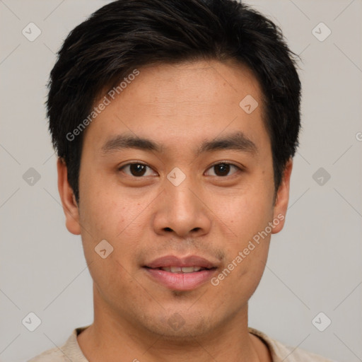 Joyful asian young-adult male with short  brown hair and brown eyes