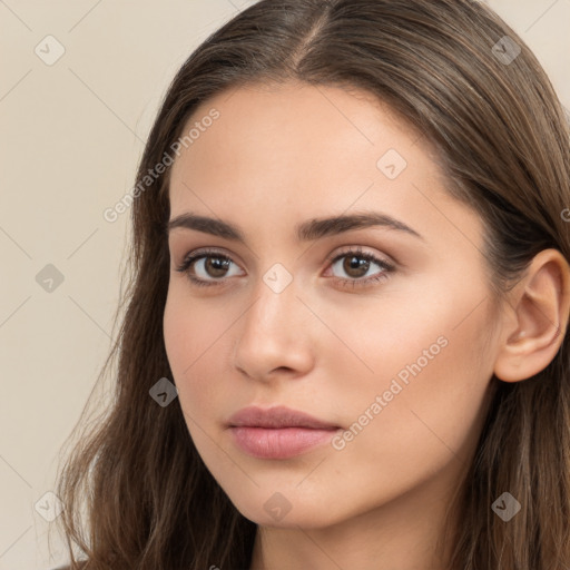 Neutral white young-adult female with long  brown hair and brown eyes