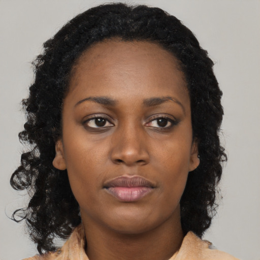 Neutral black young-adult female with long  black hair and brown eyes
