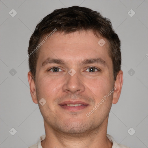 Joyful white young-adult male with short  brown hair and brown eyes