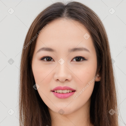 Joyful asian young-adult female with long  brown hair and brown eyes