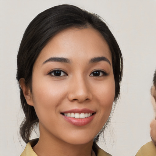 Joyful white young-adult female with medium  brown hair and brown eyes