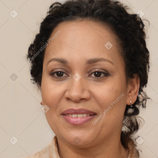 Joyful latino adult female with medium  brown hair and brown eyes