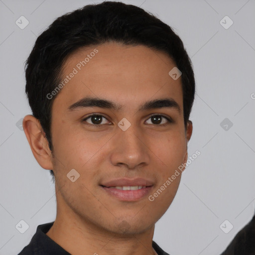 Joyful latino young-adult male with short  brown hair and brown eyes