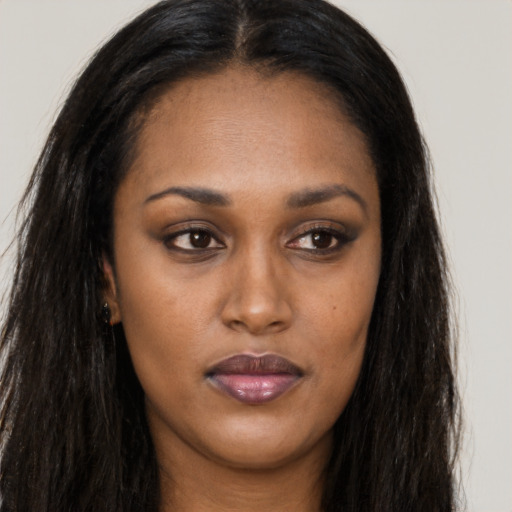 Joyful asian young-adult female with long  brown hair and brown eyes