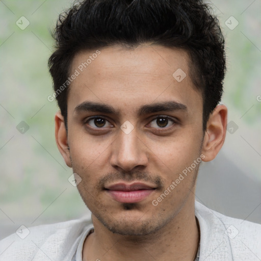 Joyful white young-adult male with short  black hair and brown eyes