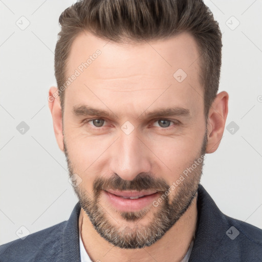 Joyful white adult male with short  brown hair and brown eyes