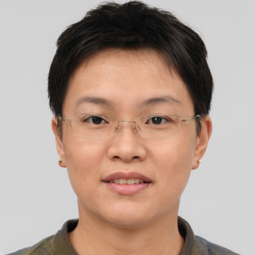 Joyful asian adult female with short  brown hair and brown eyes