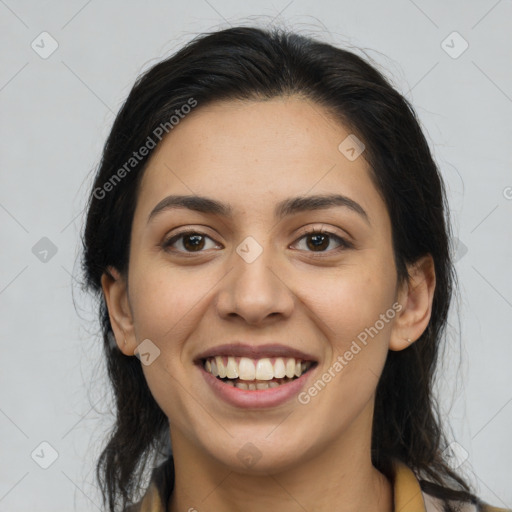 Joyful latino young-adult female with long  brown hair and brown eyes