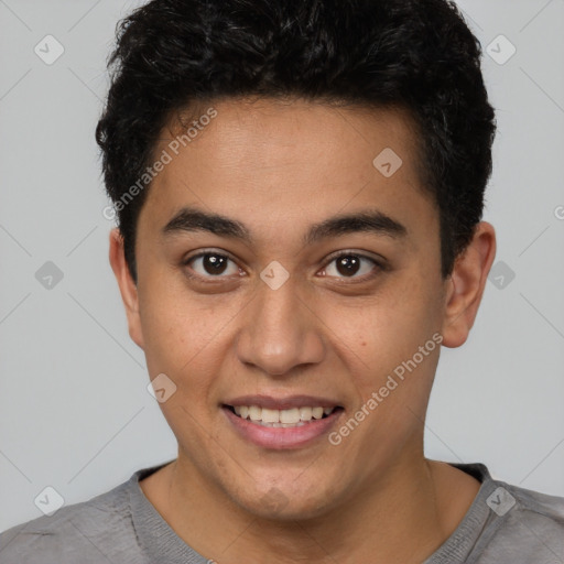 Joyful latino young-adult male with short  brown hair and brown eyes