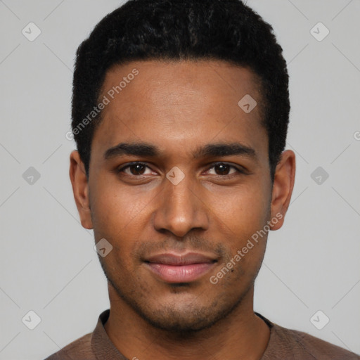 Joyful black young-adult male with short  black hair and brown eyes