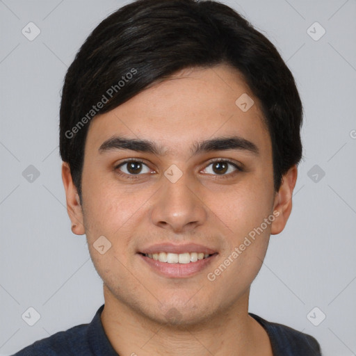 Joyful white young-adult male with short  black hair and brown eyes