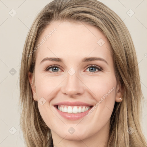 Joyful white young-adult female with long  brown hair and green eyes