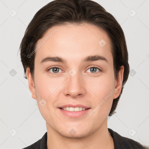 Joyful white young-adult female with short  brown hair and grey eyes