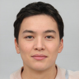 Joyful asian young-adult male with short  brown hair and brown eyes