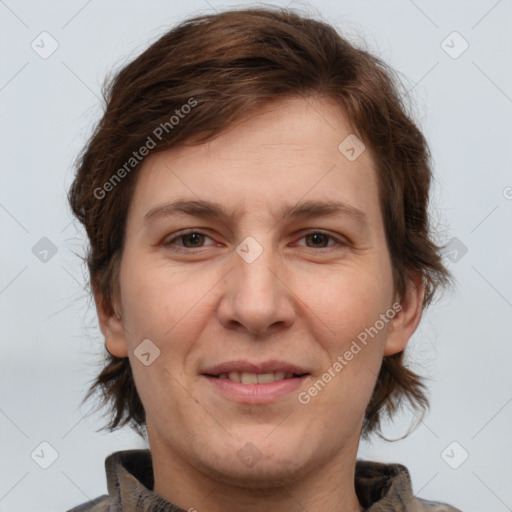 Joyful white adult female with medium  brown hair and brown eyes