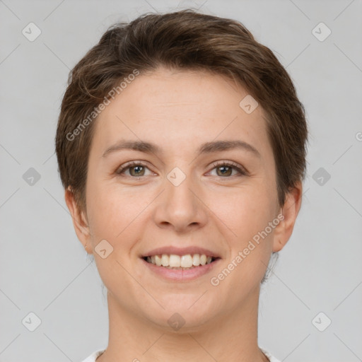 Joyful white young-adult female with short  brown hair and grey eyes