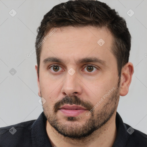 Neutral white young-adult male with short  brown hair and brown eyes