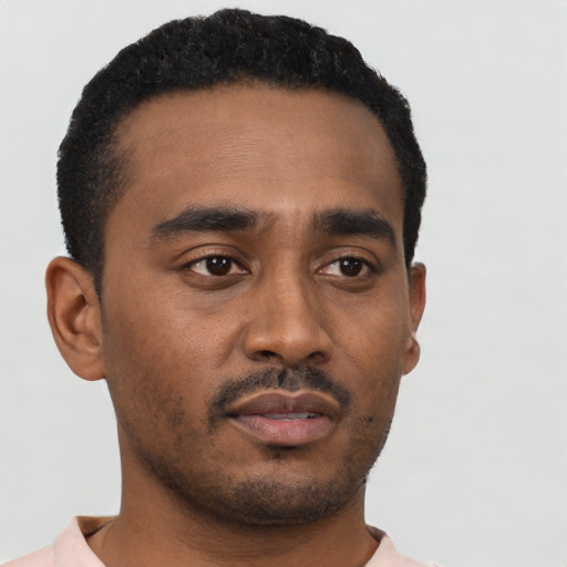 Neutral black young-adult male with short  black hair and brown eyes