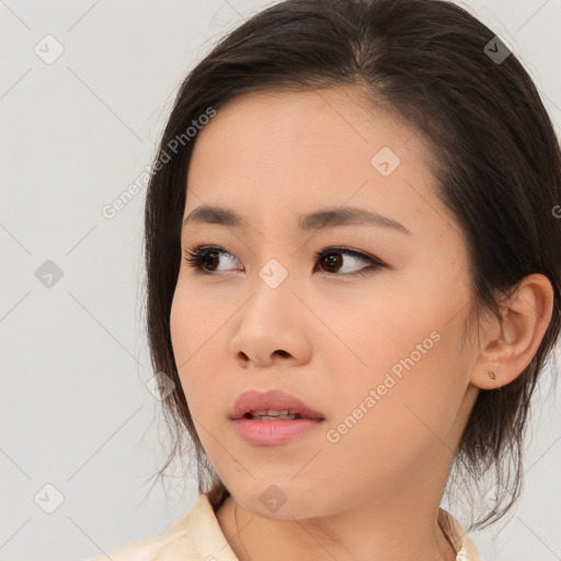 Neutral asian young-adult female with medium  brown hair and brown eyes