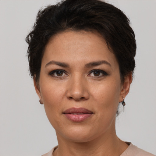Joyful white adult female with short  brown hair and brown eyes