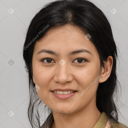 Joyful latino young-adult female with medium  brown hair and brown eyes