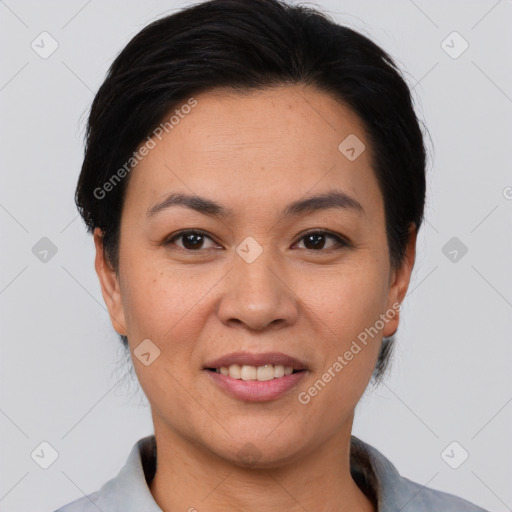 Joyful asian young-adult female with short  black hair and brown eyes