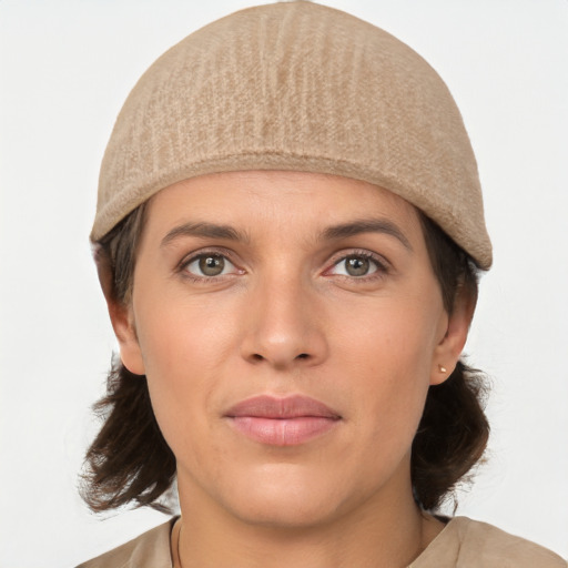 Joyful white young-adult female with medium  brown hair and grey eyes