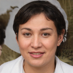 Joyful white adult female with medium  brown hair and brown eyes