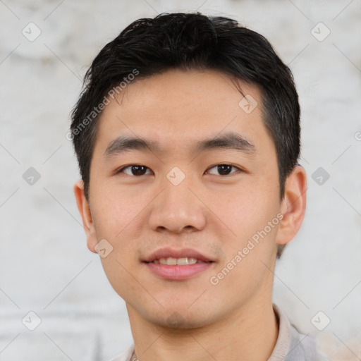 Joyful asian young-adult male with short  black hair and brown eyes