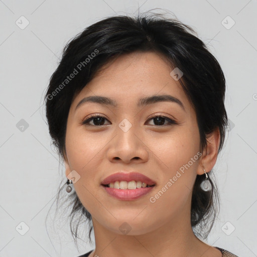 Joyful asian young-adult female with medium  black hair and brown eyes