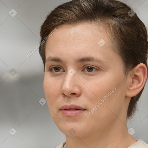 Neutral white young-adult female with short  brown hair and brown eyes