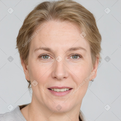 Joyful white adult female with medium  brown hair and grey eyes