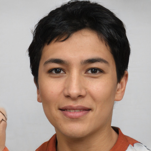 Joyful white young-adult male with short  black hair and brown eyes