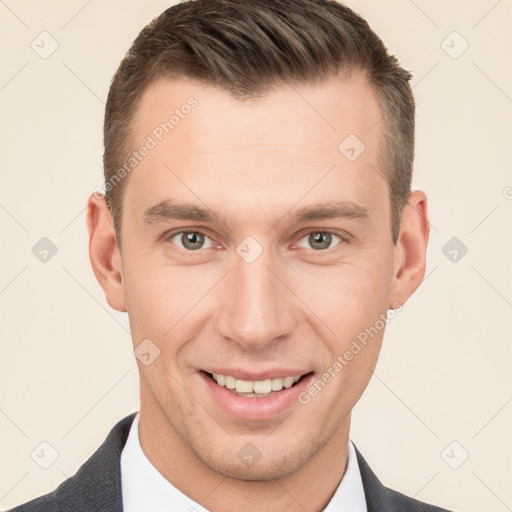 Joyful white young-adult male with short  brown hair and brown eyes