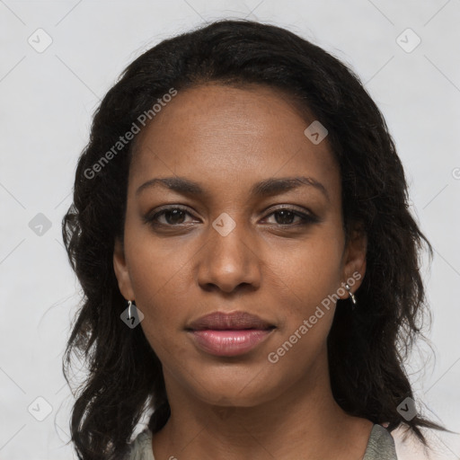 Joyful black young-adult female with long  brown hair and brown eyes