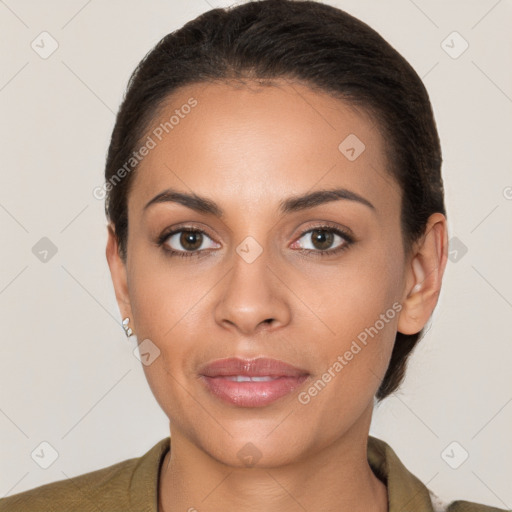 Joyful latino young-adult female with short  brown hair and brown eyes