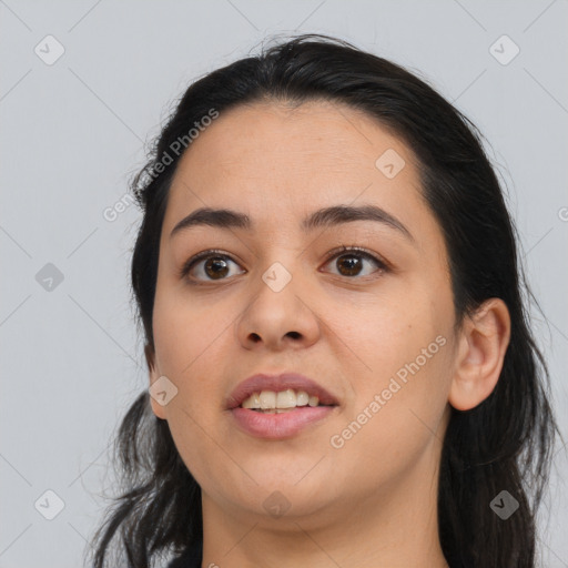 Joyful white young-adult female with long  black hair and brown eyes