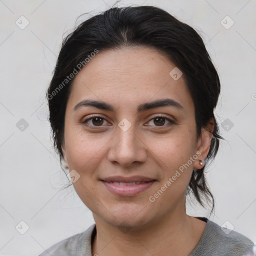 Joyful latino young-adult female with medium  brown hair and brown eyes