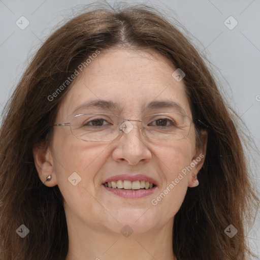 Joyful white adult female with long  brown hair and brown eyes