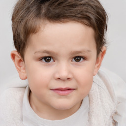 Joyful white child male with short  brown hair and brown eyes