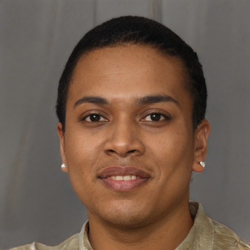 Joyful black young-adult female with short  brown hair and brown eyes