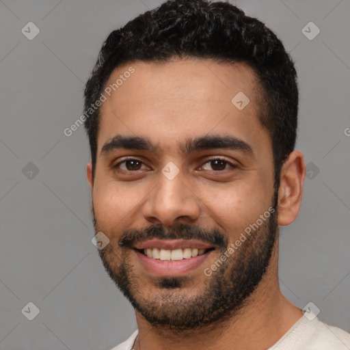 Joyful latino young-adult male with short  black hair and brown eyes